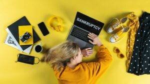 Top view of frustrated business woman at desk , coronavirus and bankruptcy desktop concept