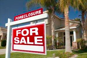 Foreclosure For Sale Real Estate Sign and House